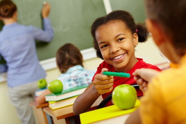 happy-student-sharing-her-green-pencil_1098-3913