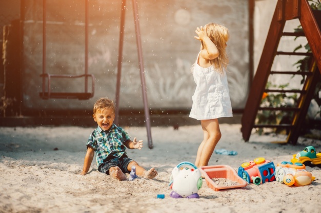 children-playing-in-a-sand-park_1153-1996.jpg